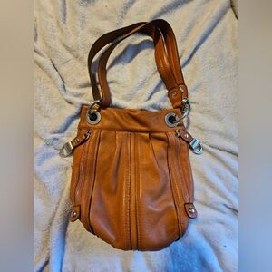 B. Makowsky orange pebbled leather crossbody bag.